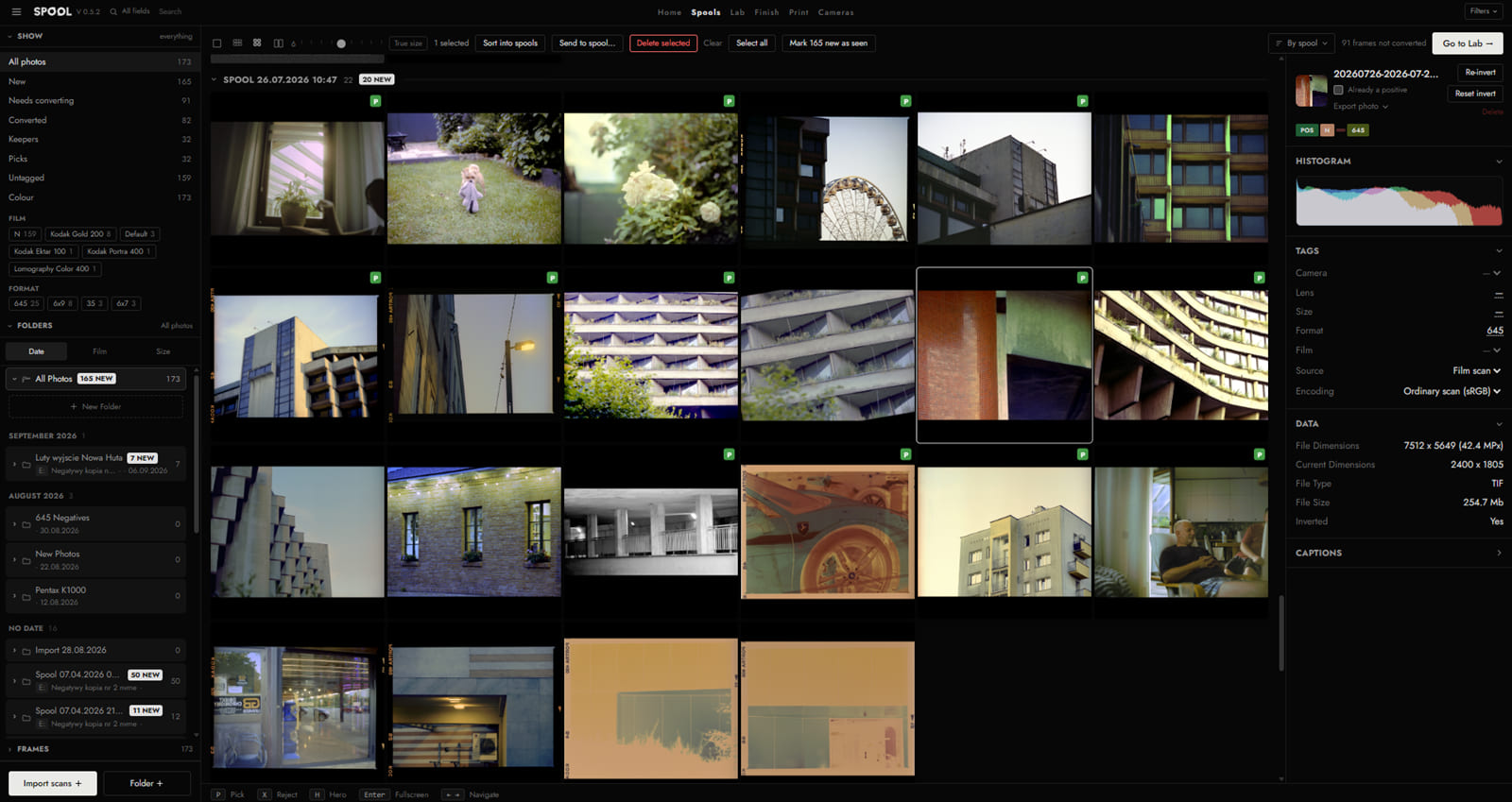 The Spools tab: filters and folders on the left, a grid of converted frames grouped by roll, and the selected frame's histogram and file data on the right